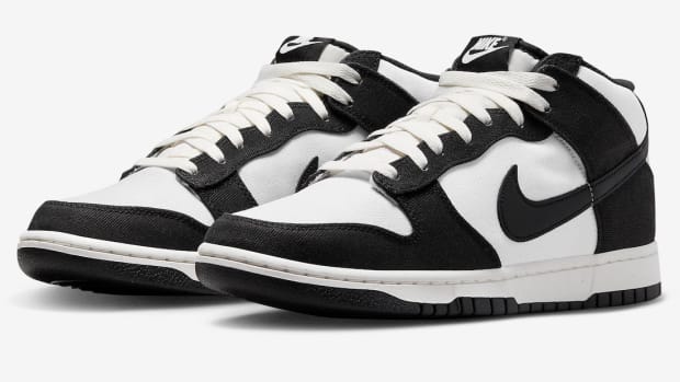 Side view of black and white Nike Dunk shoes.